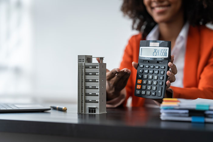 African American realtor working at desk, Housing estate, Vacanc African American realtor working at desk, Housing estate, Vacancy, Prime location, Low Rise